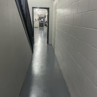 Grey epoxy flooring with anti slip in Toronto factory.