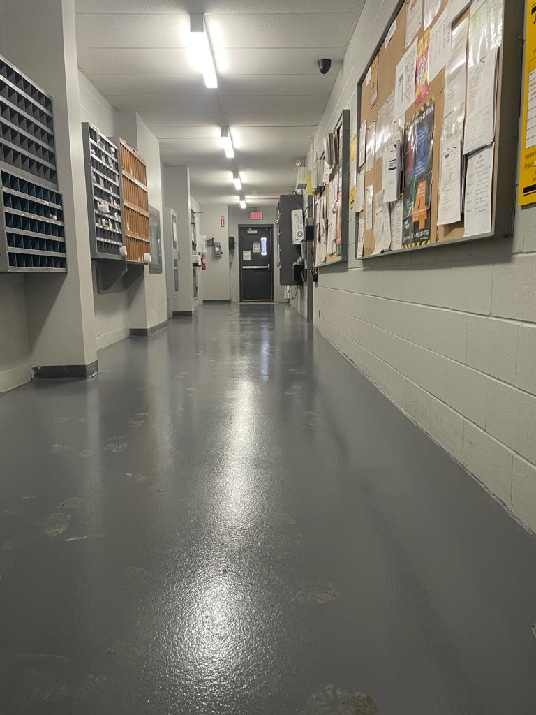 Grey epoxy flooring with anti slip in Toronto factory.