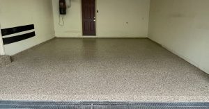 Image depicts a 1-car garage in Toronto with new epoxy floors.