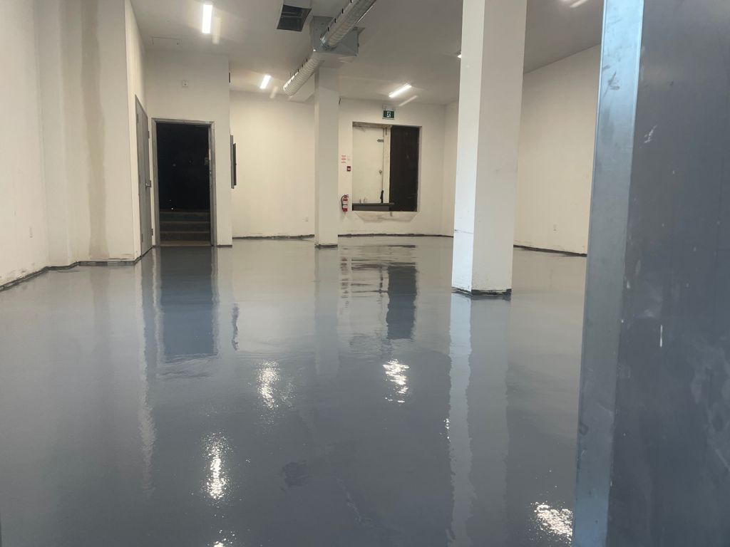 Image depicts the interior of a commercial property with commercial grade epoxy floors.