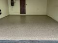 Image depicts a 1-car garage in Toronto with new epoxy floors.