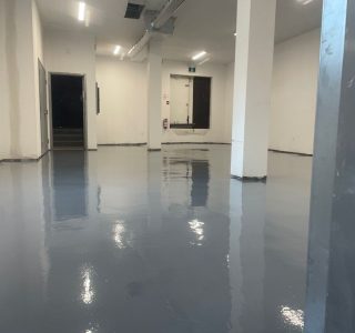 Image depicts the interior of a commercial property with commercial grade epoxy floors.