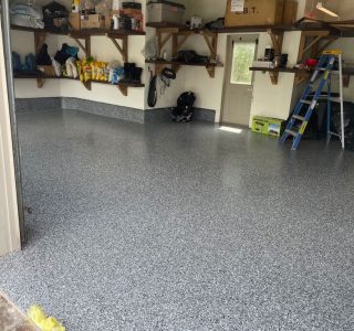 Image depicts a garage from our epoxy 2-car garage Woodbridge project, showing a garage with new epoxy flooring.
